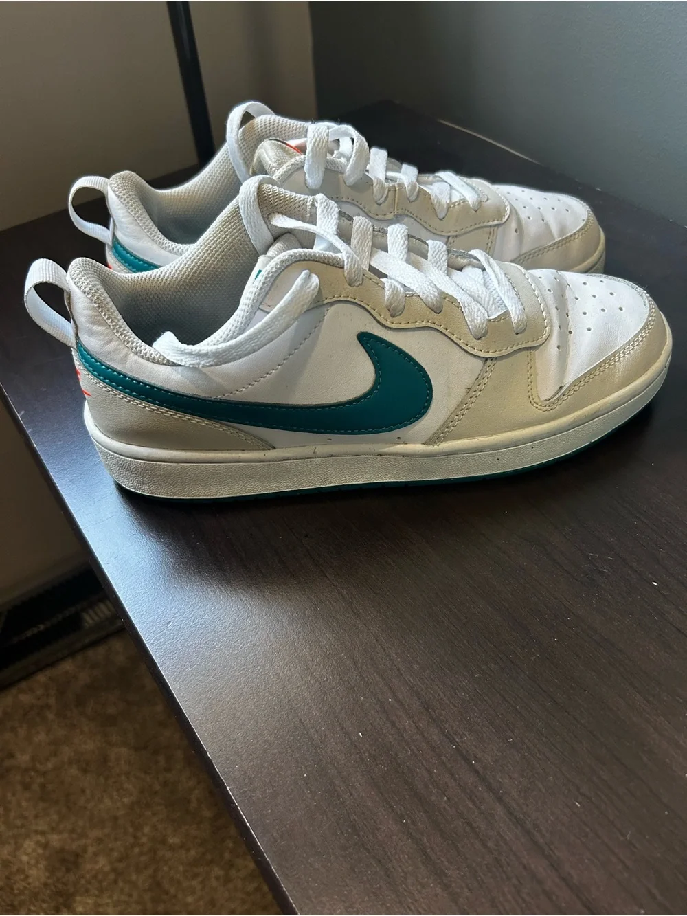 Nike White Low-Top Sneakers with Teal Swoosh Accent